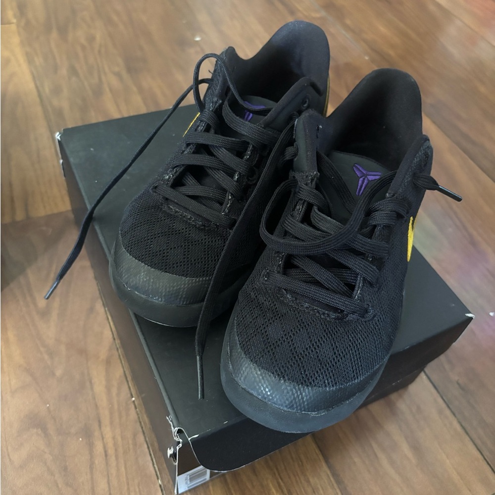 Nike Kids Black Sneakers with Purple and Yellow Accents